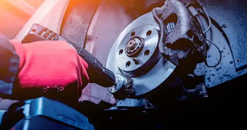 Technician servicing brake rotor for auto brake repair in Belleville IL